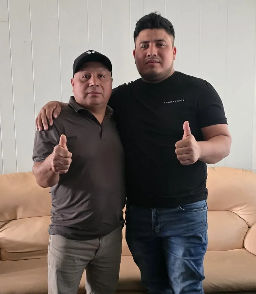 Fidel and his son Daniel, the father-and-son team behind Fidel Remodeling, giving a thumbs up